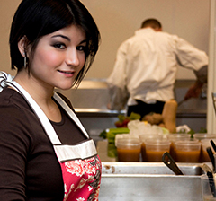 Photo of our nutritionist Lisa Suriano posing in the kitchen